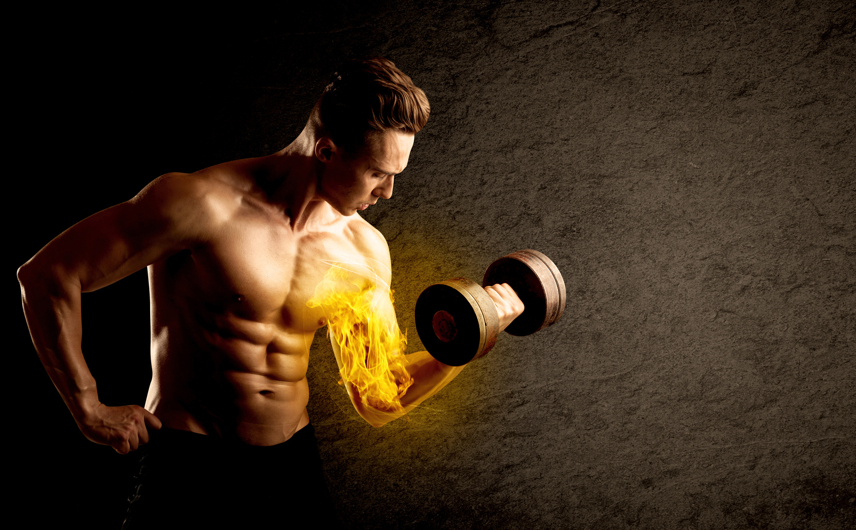 Muscular bodybuilder lifting weight with flaming biceps concept